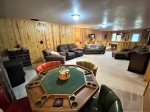 Lower level Family Room with TV, poker table, Pellet Stove